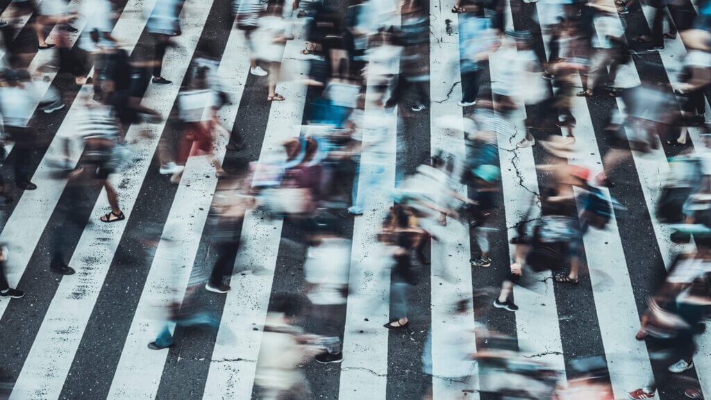 Busy cross walk as a metaphor for quickly changing financial markets